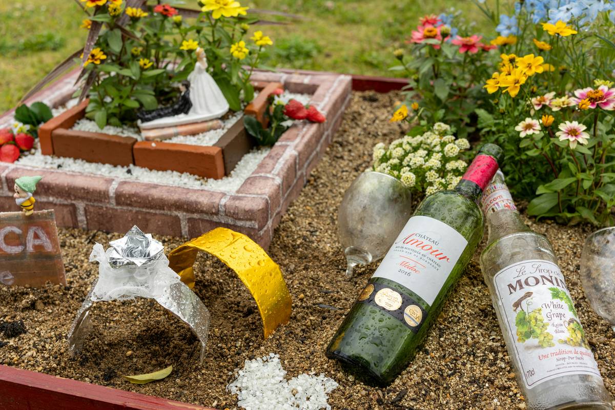Set of eco-friendly insulated wine glasses secured in outdoor wine glass holder on a picnic blanket