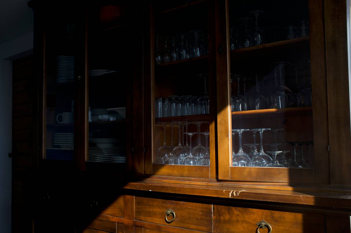 Organized cabinet with insulated wine glasses spaced apart, showcasing ideal storage for wine glasses