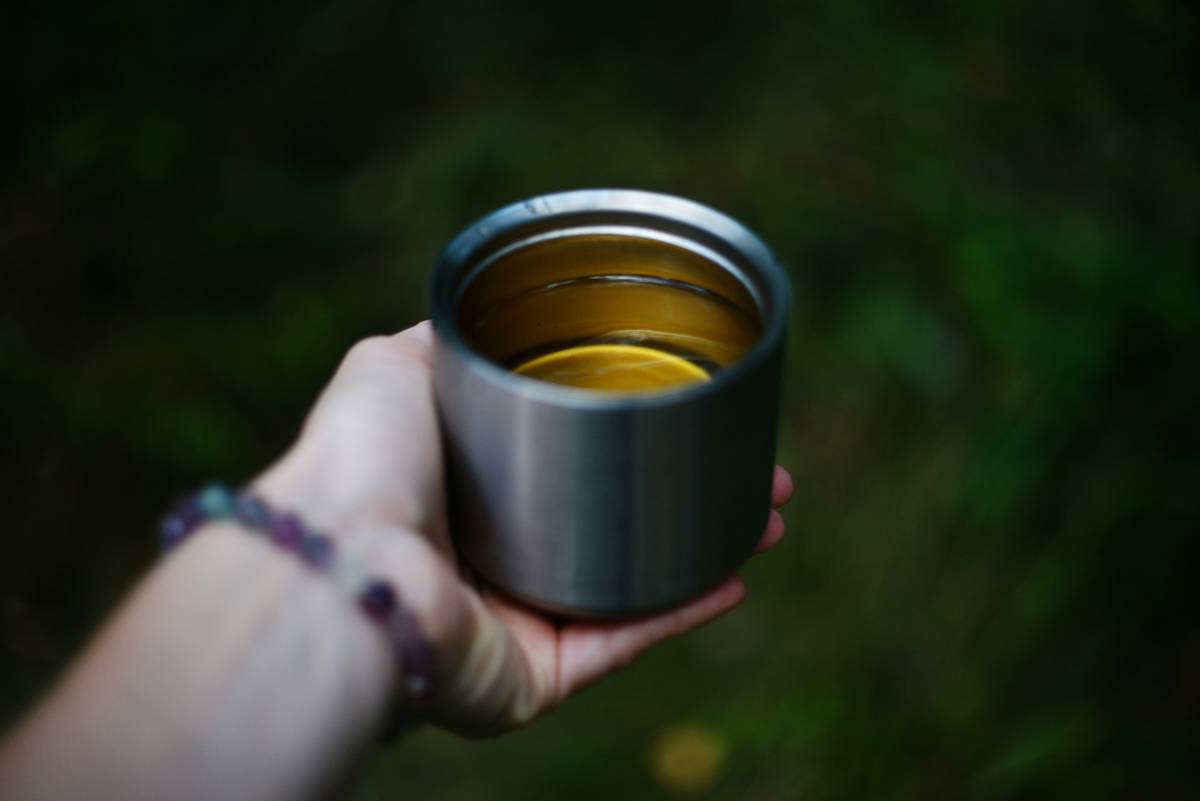 Comparison of barware insulated wine glasse made from sustainable materials on a picnic table with temperature readings